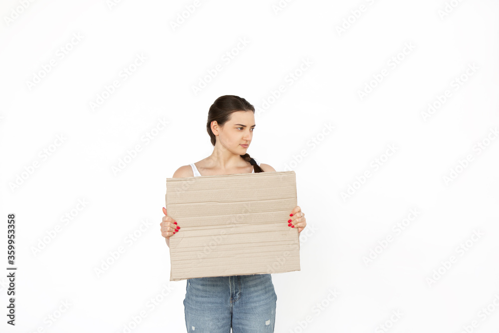 Young woman protesting with blank board, sign isolated on white studio background. Activism, active social position, protest, actual problems. Meeting against human rights, abusing, freedom of choice. Young woman protesting with blank board, sign isolated on white studio background. Activism, active social position, protest, actual problems. Meeting against human rights, abusing, freedom of choice.