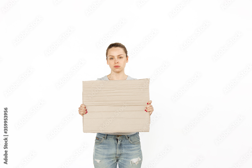 Young woman protesting with blank board, sign isolated on white studio background. Activism, active social position, protest, actual problems. Meeting against human rights, abusing, freedom of choice. Young woman protesting with blank board, sign isolated on white studio background. Activism, active social position, protest, actual problems. Meeting against human rights, abusing, freedom of choice.