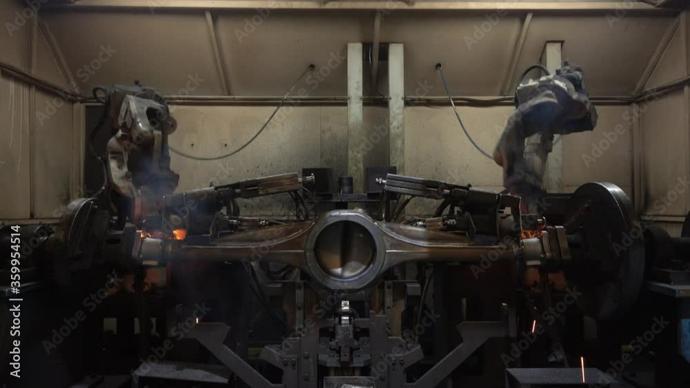Automation welding mechanical procedure.,Industrial Robot arm active in factory Automation welding mechanical procedure.,Industrial Robot arm active in factory