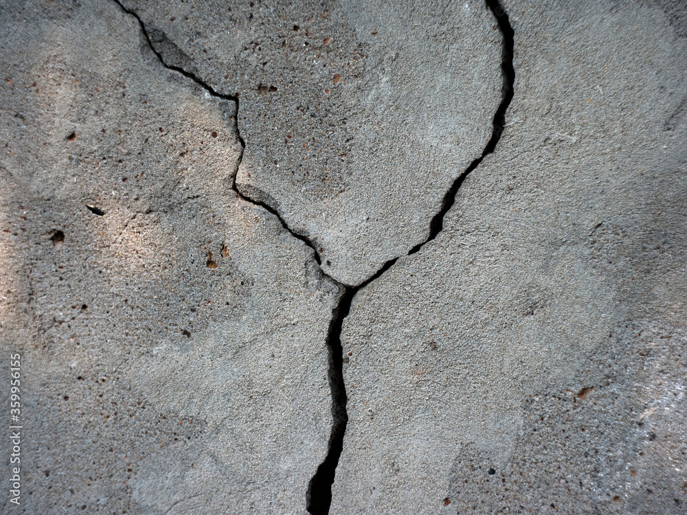 Fototapeta premium plastered textured wall with cracks and pebbles