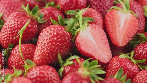 Ripe strawberries rotate macro shooting, seasonal red berry, homemade strawberries