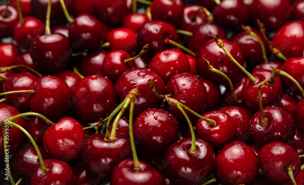 Fresh ripe black cherries background Top view 