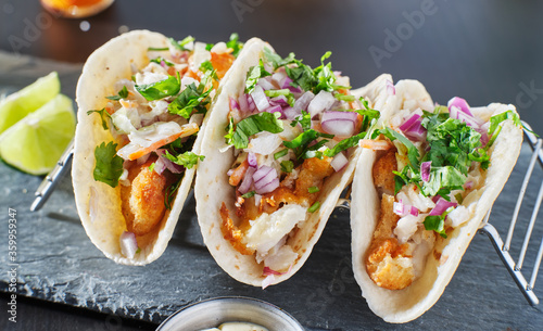 Photography mexican fish tacos in metal tray