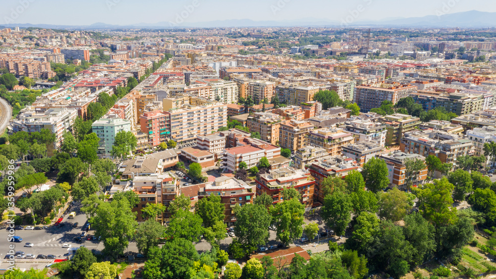 Aerial view of the Portuense district in Rome, Italy. there are many buildings and trees along via Marconi.