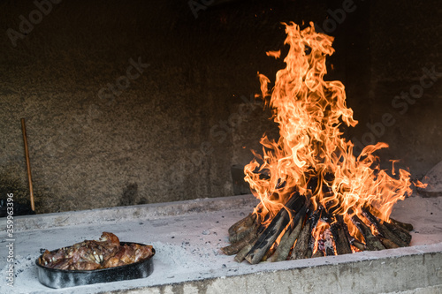 Cooking meat in flaming oven, traditional Croatian style