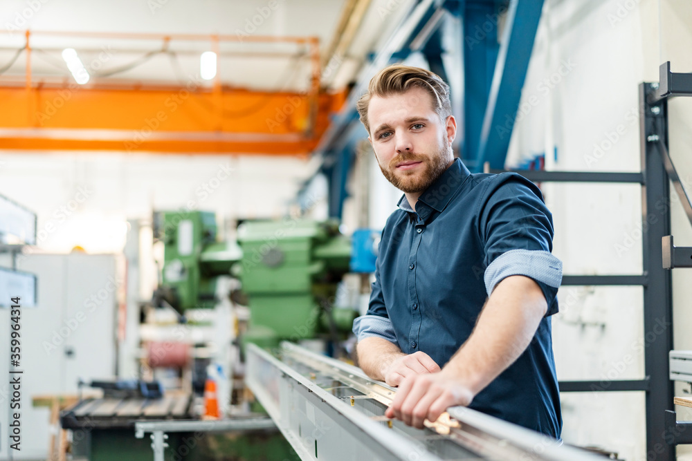 Portrait of a confident young man in a factory Portrait of a confident young man in a factory