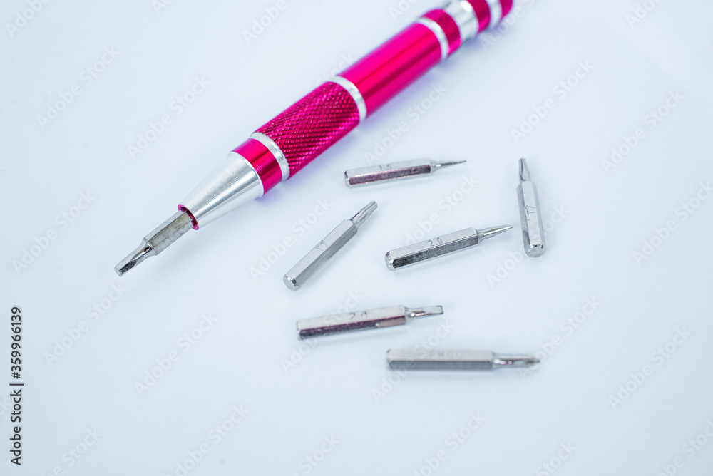 Screw-driver with nozzles on a white background.   