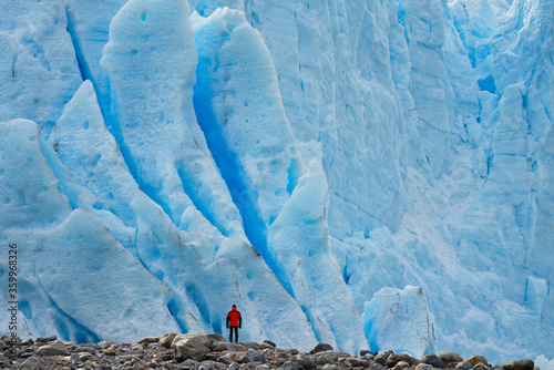 Man in front of Perito Moreno Glacier, El Calafate, Los Glaciares National Park, Patagonia, Argentina photo