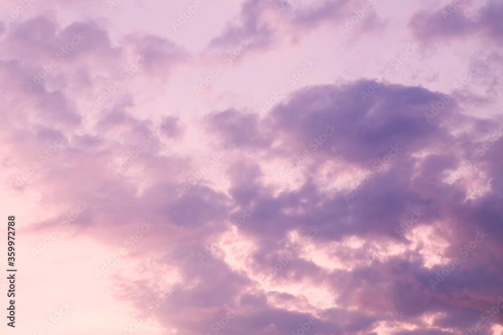 Fototapeta premium Beautiful bright colorful pink red yellow clouds on dark sky at sunset or sunrise. Evening or morning sky natural eco background. Amazing nature texture surface wallpaper.