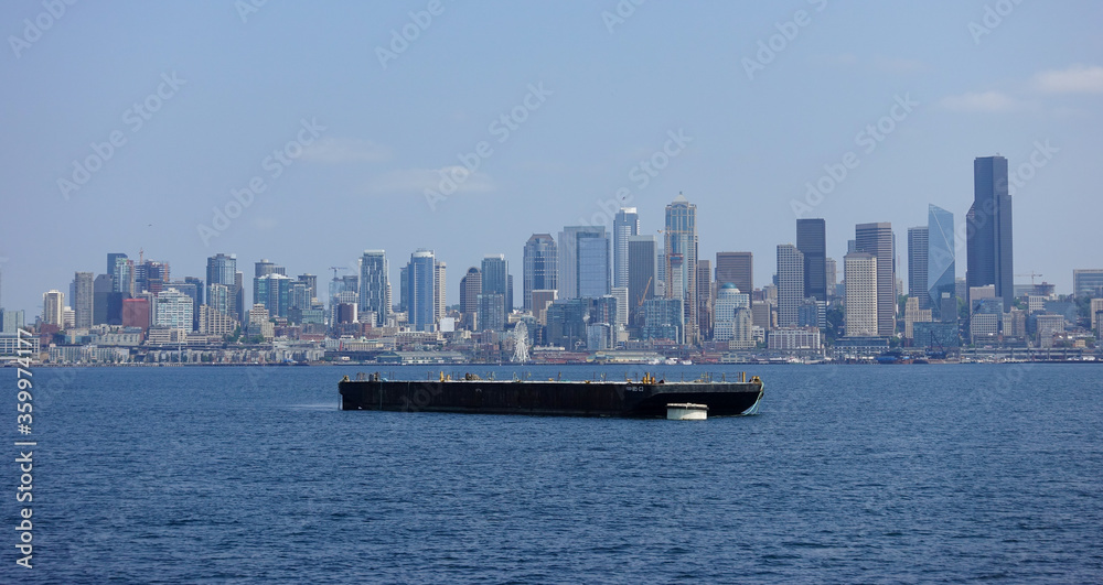 Large barge near the skyline of Seattle, Washington