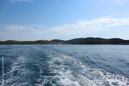 Leaving Vrgada island behind and sailing out to the open, Adriatic sea in central Dalmatia, Croatia