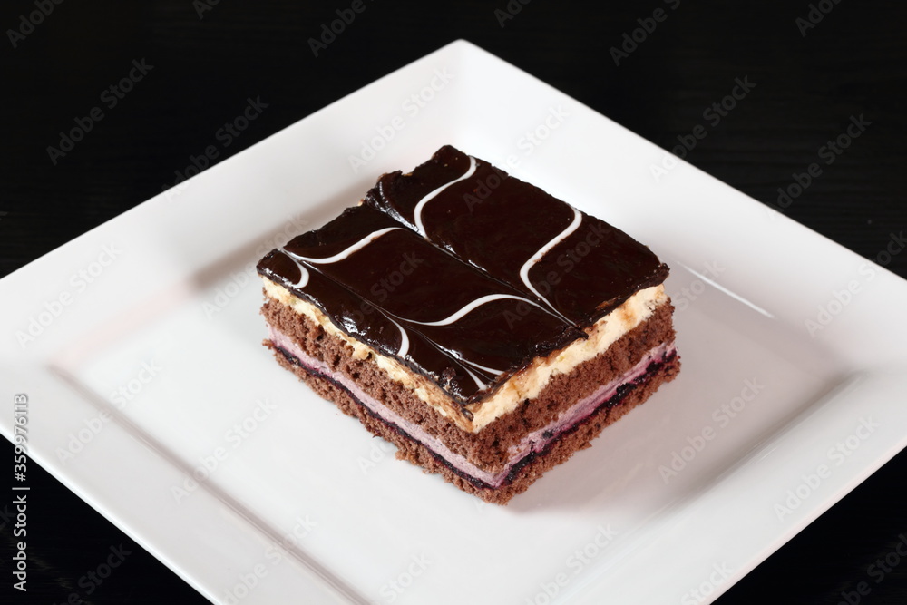 Layer cake with fruit and cream fillings decorated chocolate icing Layer cake with fruit and cream fillings decorated chocolate icing