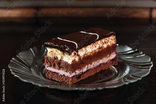 Layer cake with fruit and cream fillings decorated chocolate icing