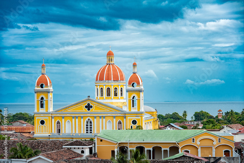 Fototapeta Cathedral of Granada from rooftop, with Lake Nicaragua in the background