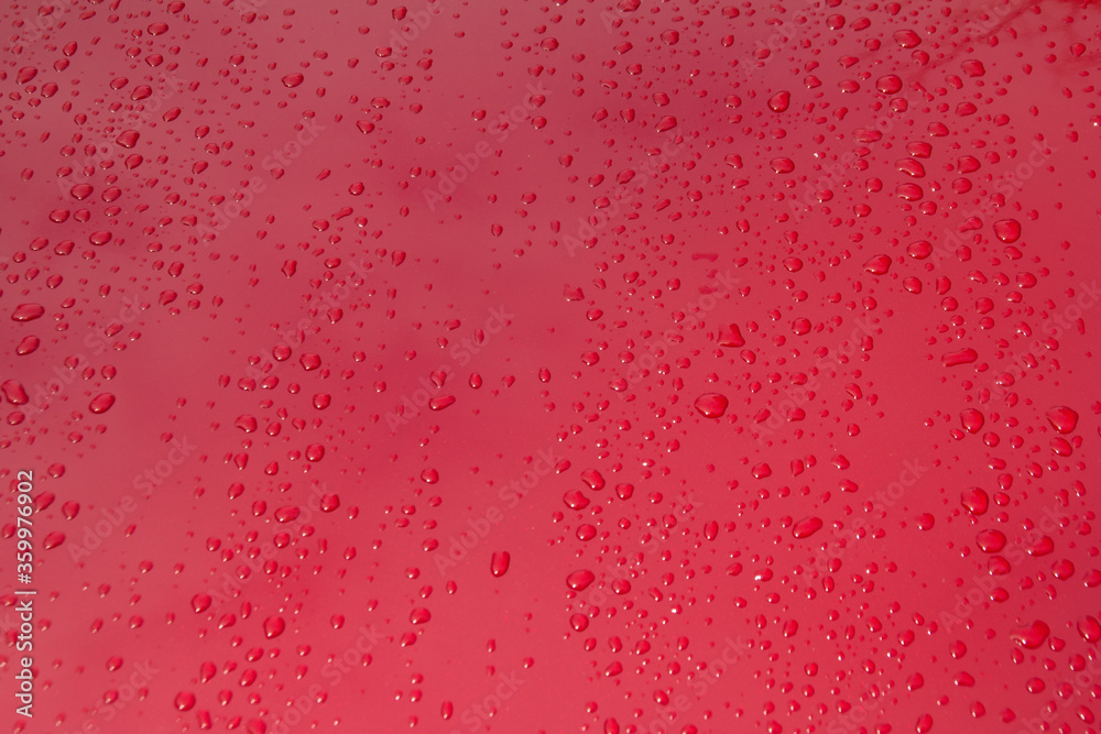 Close up raindrop on red car, After raining Close up raindrop on red car, After raining