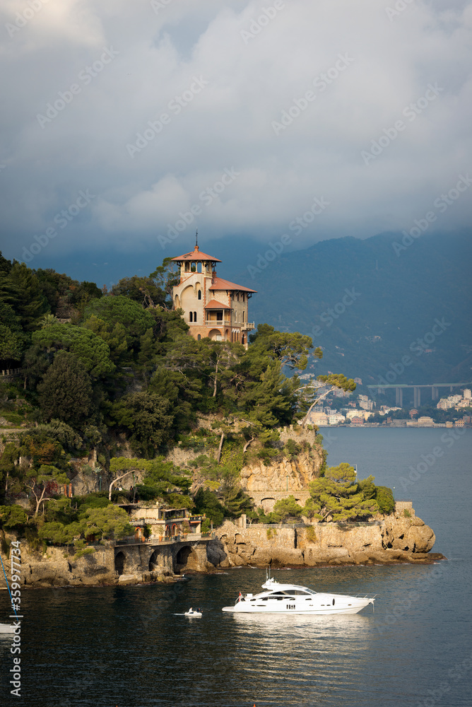 Luxury yacht and ancient villa in the port of the famous and ancient village of Portofino. Genoa Province, Liguria, Italy, Europe