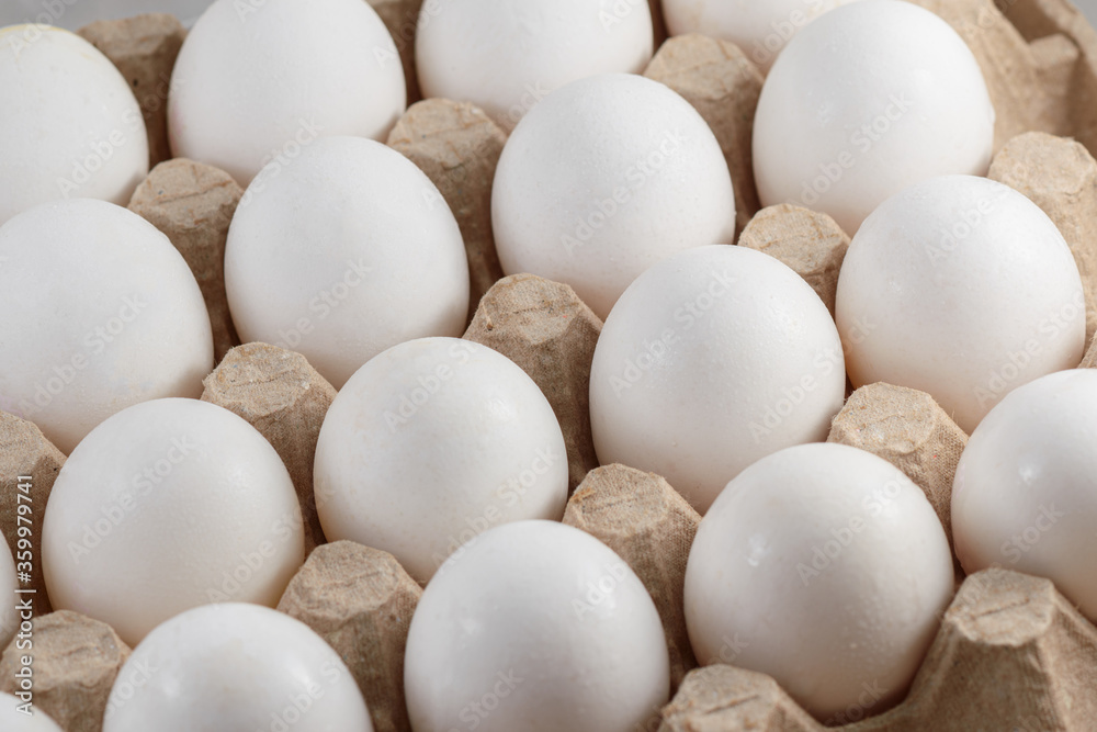 Many white chicken eggs food in tray box Many white chicken eggs food in tray box
