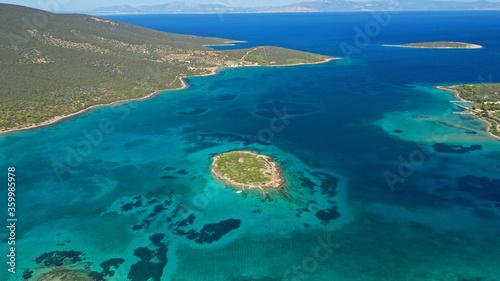 Fototapeta Naklejka Na Ścianę i Meble -  Aerial drone photo of beautiful paradise island complex in gulf of Petalion that form a blue lagoon in South Evia island near Marmari, Greece