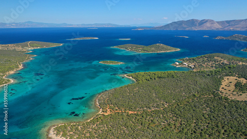 Aerial drone photo of beautiful paradise island complex in gulf of Petalion that form a blue lagoon in South Evia island near Marmari, Greece