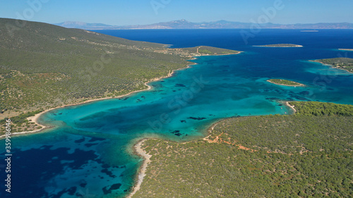 Aerial drone photo of beautiful paradise island complex in gulf of Petalion that form a blue lagoon in South Evia island near Marmari, Greece © aerial-drone