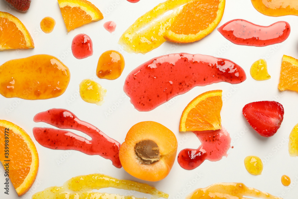 Apricot, strawberry, orange and jams on white background Apricot, strawberry, orange and jams on white background