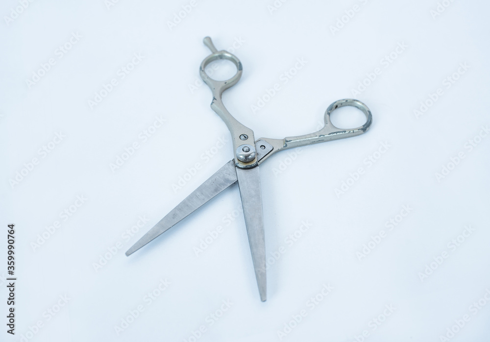 Rusty scissors isolated on white background. Old silver metal open scissors white background isolated close up, retro style haircut shears, tailor pair of scissors. Rusty scissors isolated on white background. Old silver metal open scissors white background isolated close up, retro style haircut shears, tailor pair of scissors.