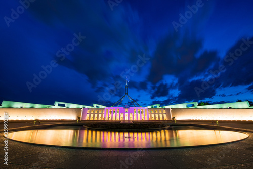 Pool of reflection at night in front of Parliament House Canberra