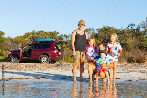 young family on a beach holiday photo