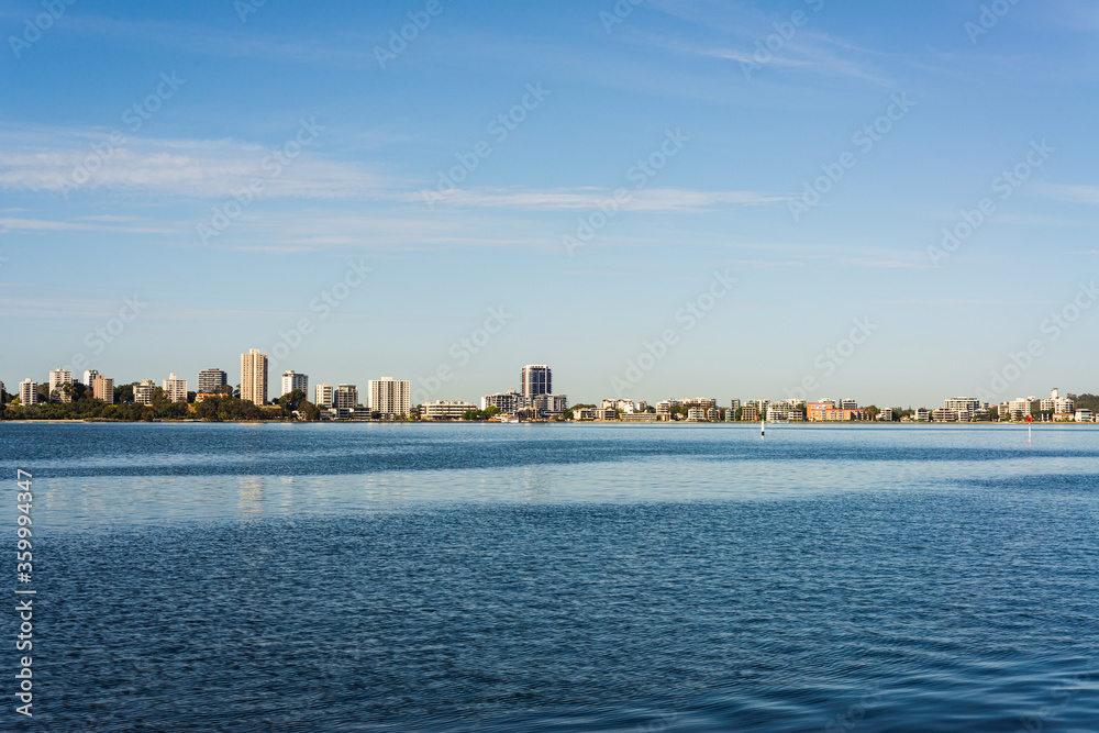 View of South Perth skyline across the tranquil blue Swan River Lake View of South Perth skyline across the tranquil blue Swan River Lake