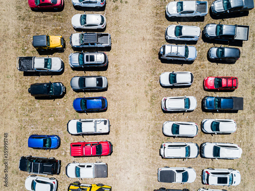 Cars in overflow carpark in paddock top down