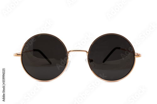 Street style oval sunglasses with thin golden metal frame, clear brown lens, isolated on white background, front view.