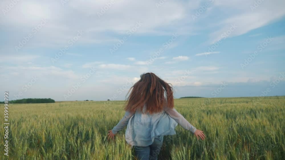 girl kid play run rejoices across the field to meet the sunlight hair flutter in hat. child daughter is running happy family freedom freedom dreams people outdoors childhood concept. girl sister runs girl kid play run rejoices across the field to meet the sunlight hair flutter in hat. child daughter is running happy family freedom freedom dreams people outdoors childhood concept. girl sister runs