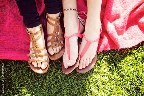 Friends feet on a blanket