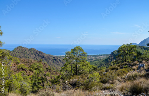 View from the top on rocks, beaches and sea. Beautiful nature landscapes in Turkey mountains. Lycian way is famous among hikers.