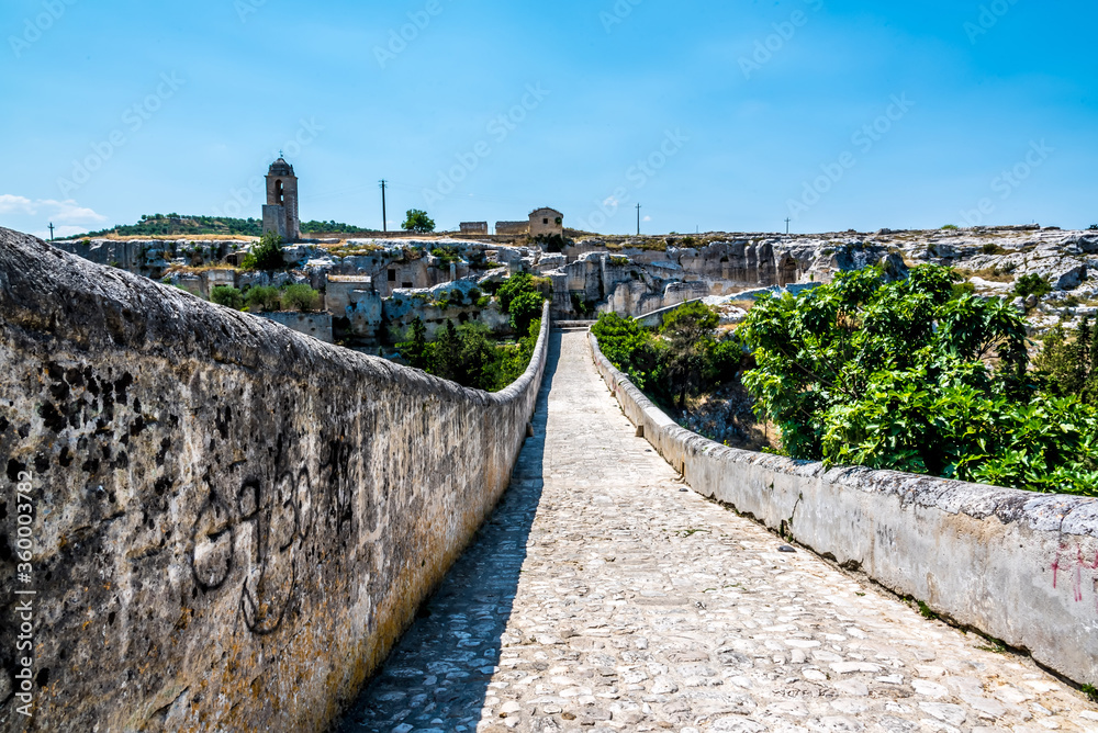 Fototapeta premium A view across the Roman bridge in Gravina, Puglia, Italy