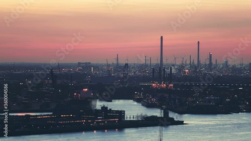 Static footage of loading and unloading docks at the Port of Rotterdam by evening.