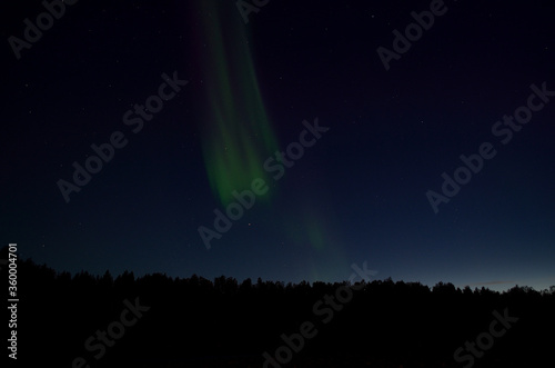 aurora borealis on blue autumn night sky