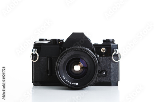 Black analogue camera. Front view. Isolated white background. Space for text