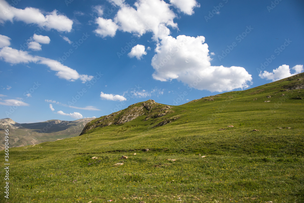 Beautiful landscape in the mountains at summer in daytime. Mountains at the sunset time. Azerbaijan, Caucasus. Khinalig Beautiful landscape in the mountains at summer in daytime. Mountains at the sunset time. Azerbaijan, Caucasus. Khinalig
