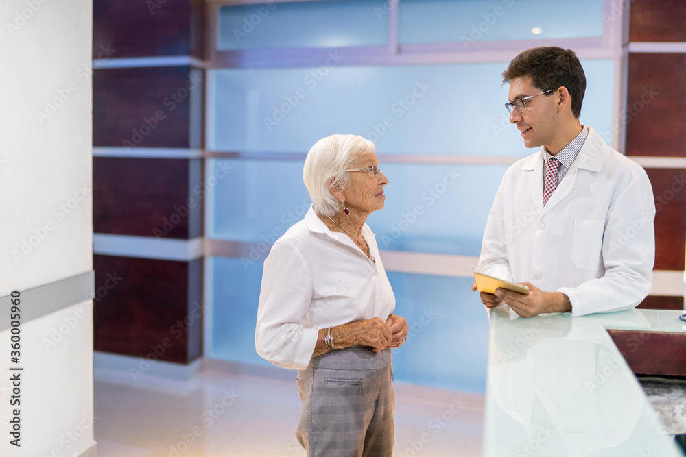 doctor chatting with older patient doctor chatting with older patient