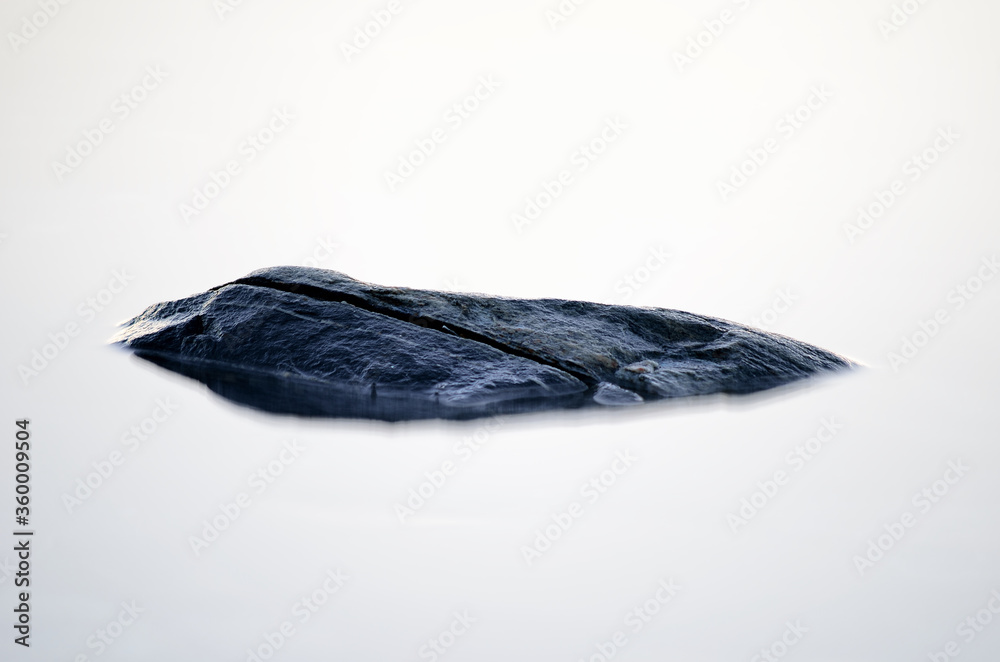 single stone in white dreamy fjord water single stone in white dreamy fjord water