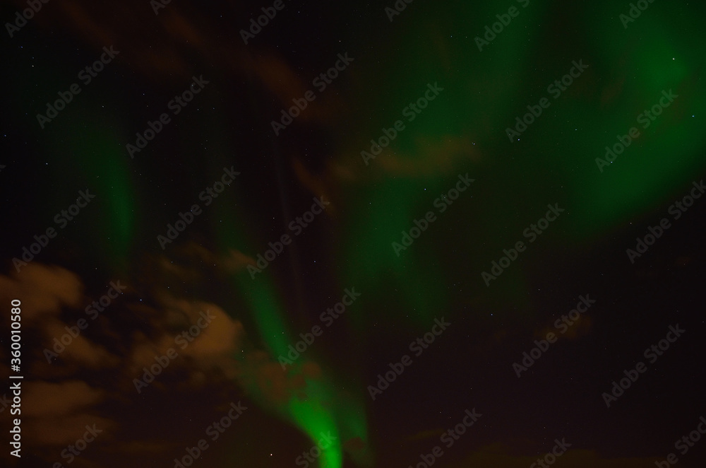 Beautiful green aurora borealis, northern light in autumn night