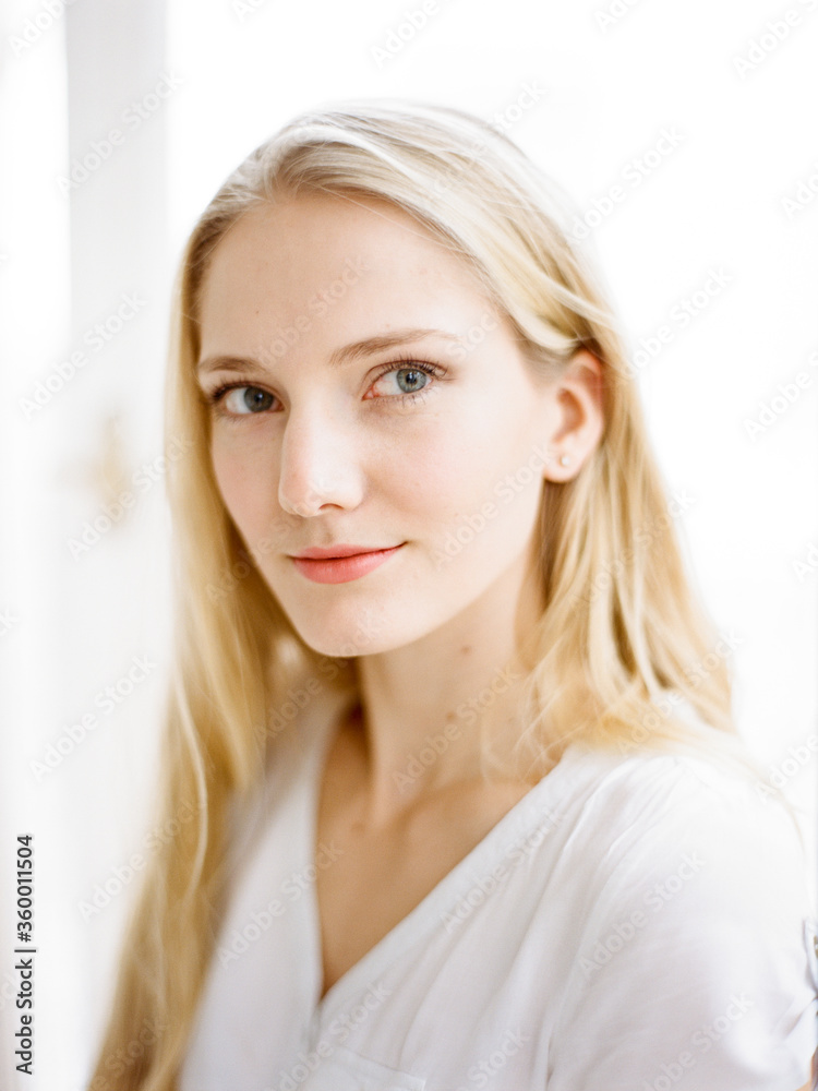 Young woman looking at window Young woman looking at window