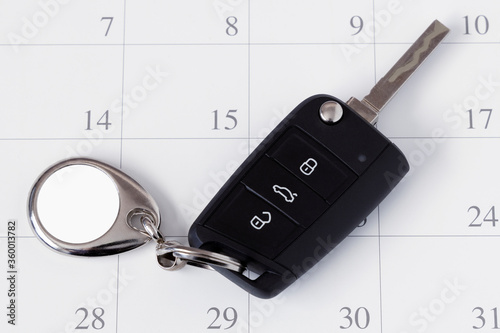 Blank Metal Car Key with Blank Empty Keychain Mockup on Calendar.