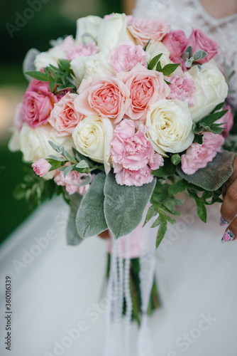 A beautiful stylish bouquet stands on the table close-up