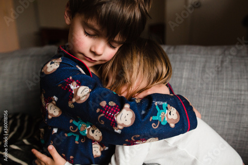 brother and sister hug