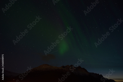 aurora borealis over autumn mountain