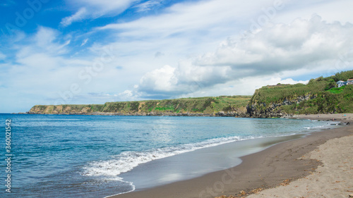 A view of a shore in Sao Miguel island  in The Azores archipelago. White clouds and blue sky in the background