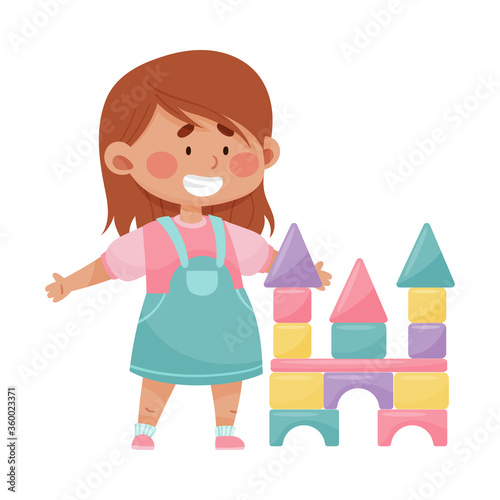 Cheerful Girl Building Castle with Tower from Blocks Vector Illustration