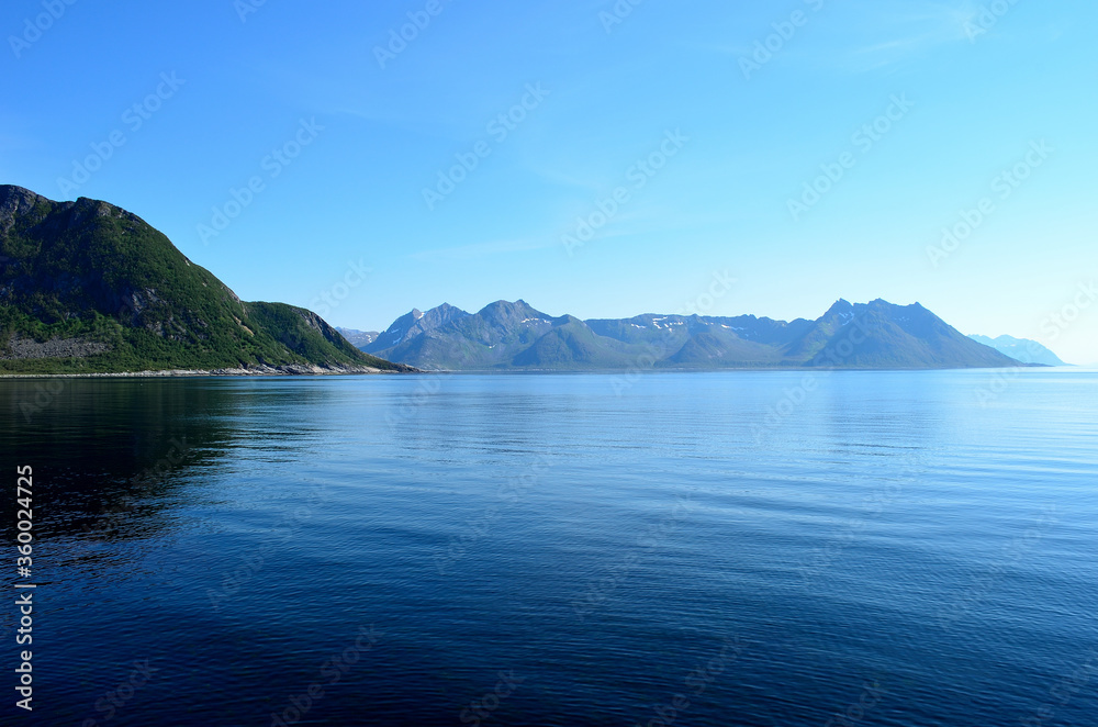 blue fjord and majestic mountains